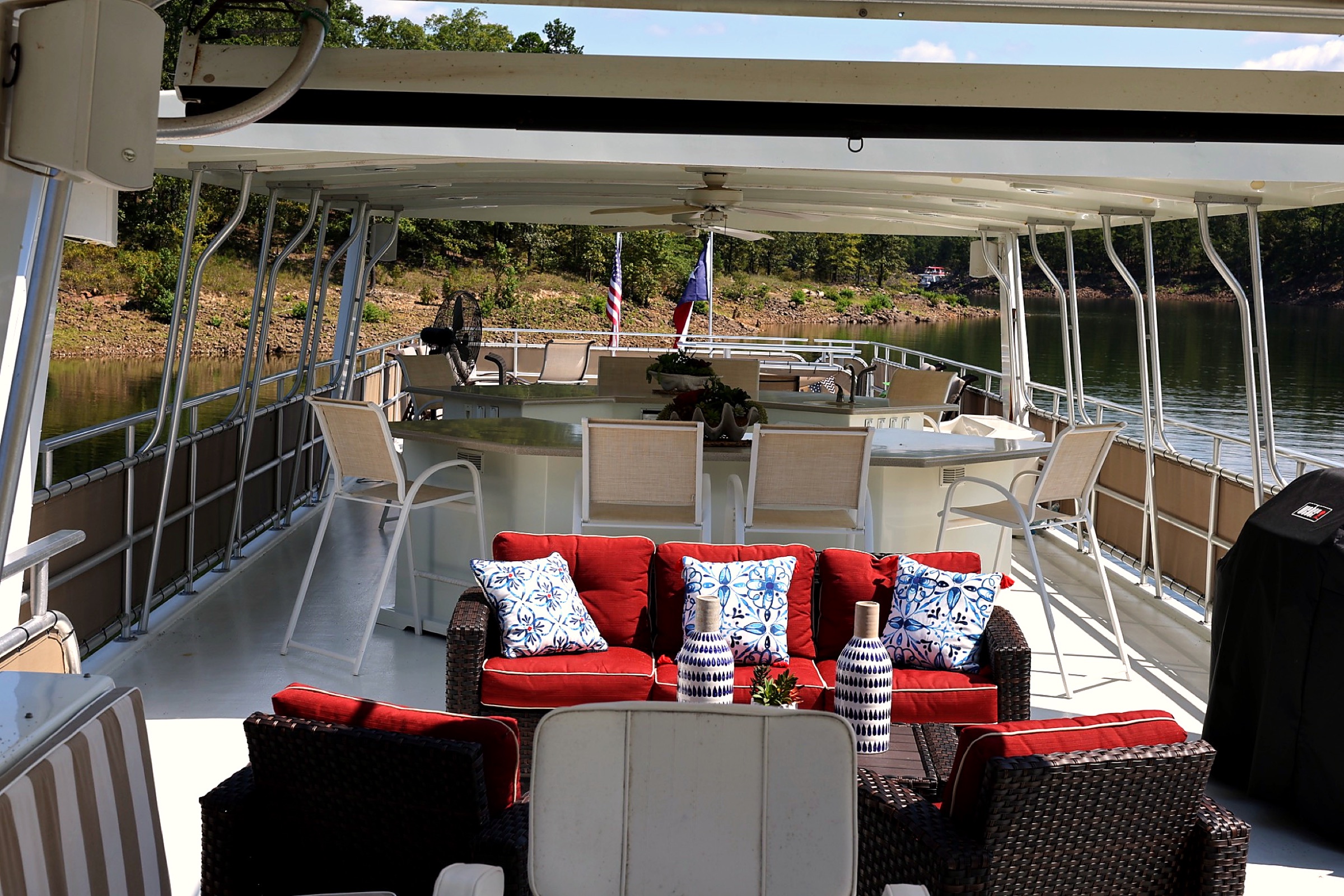Covered upper-deck lounge, wet bar, and dining area