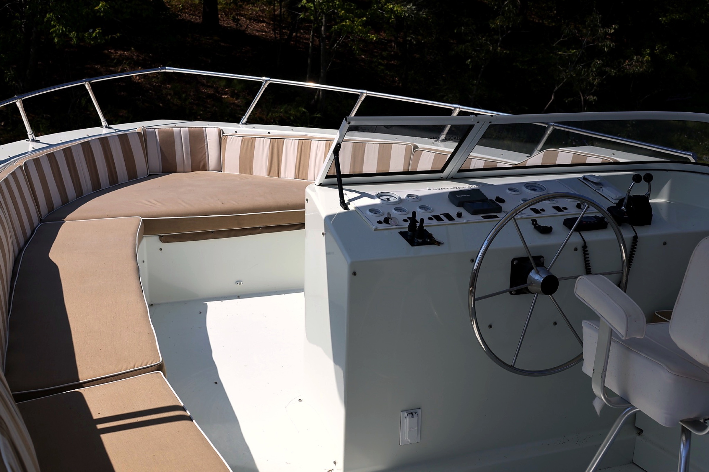 Upper helm controls and wraparound bow seating in daylight