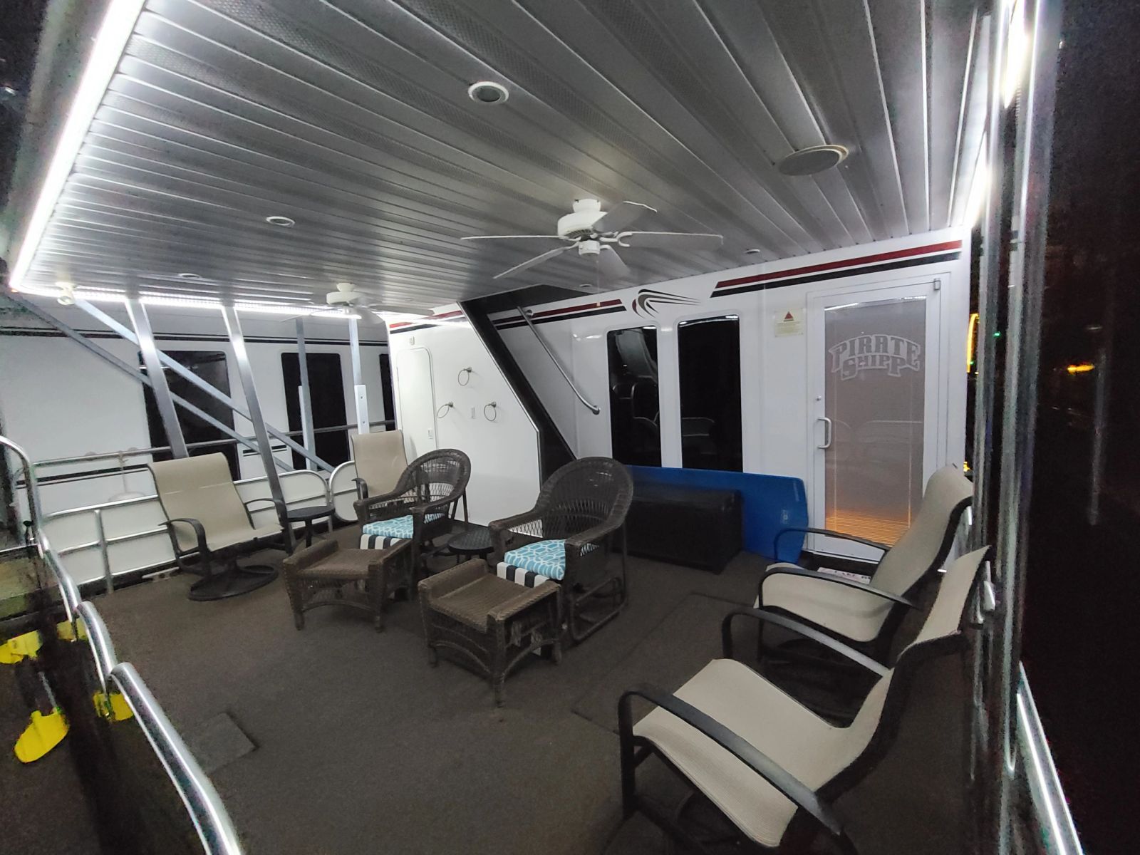 Covered aft deck with dining and lounge seating