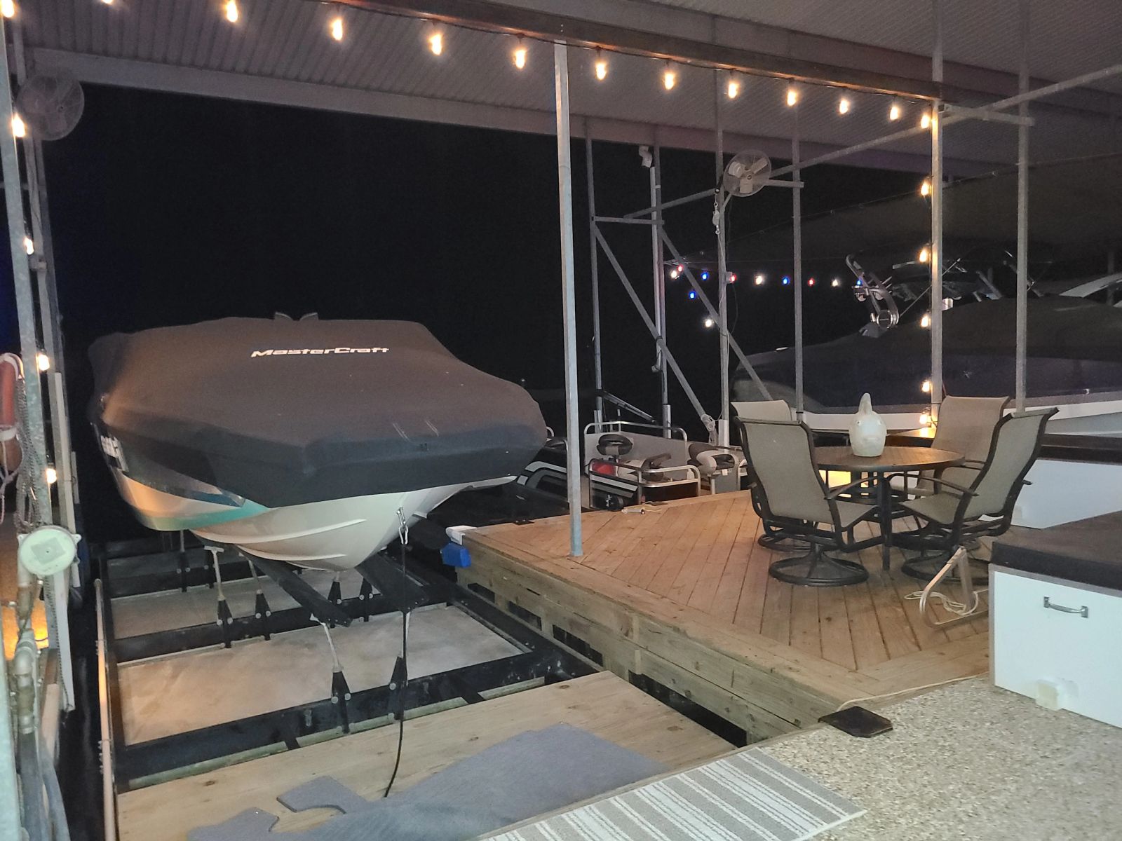 Separate toy slip with boat lift and dock storage