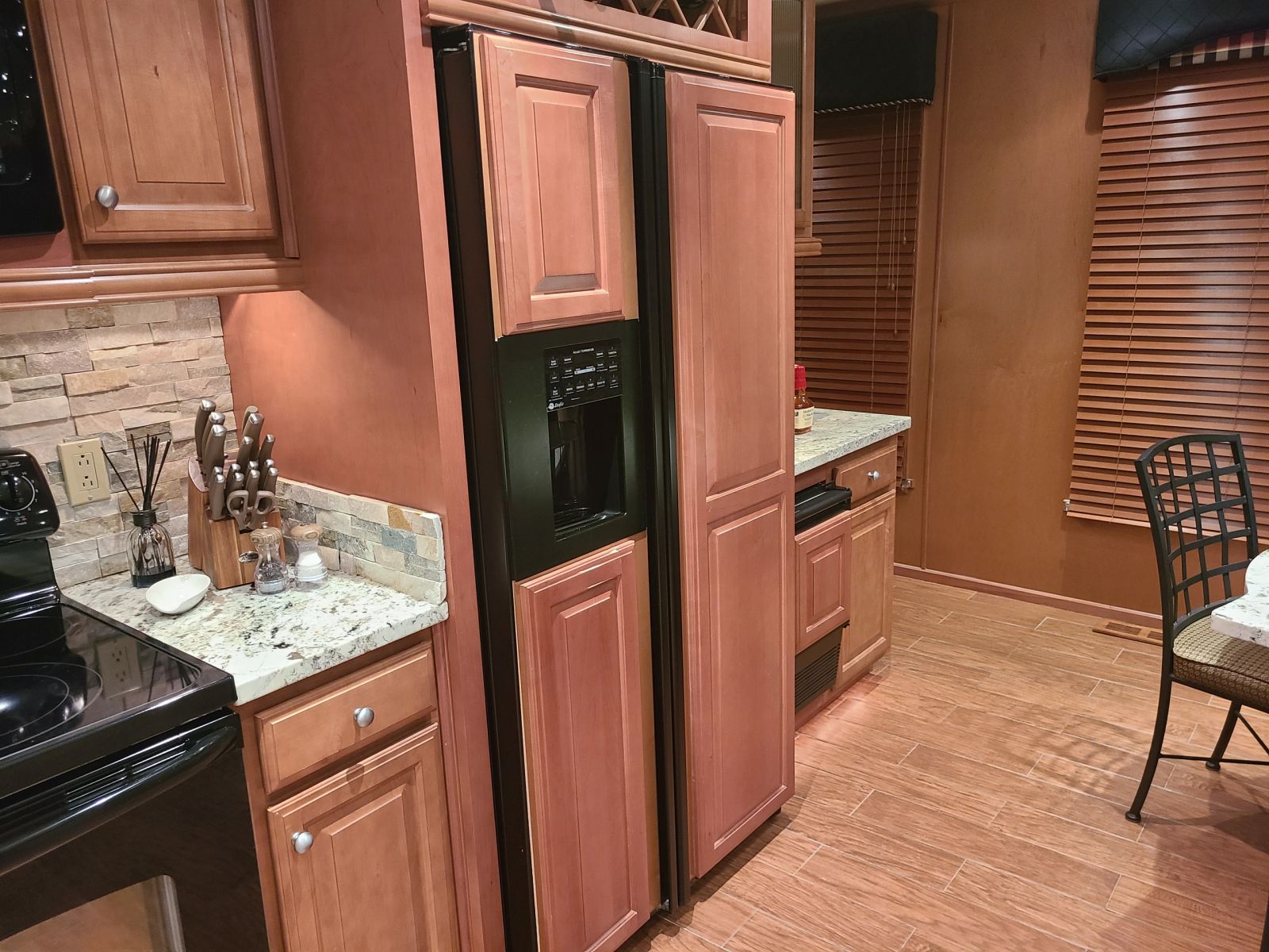Kitchen refrigerator, pantry, and dining area