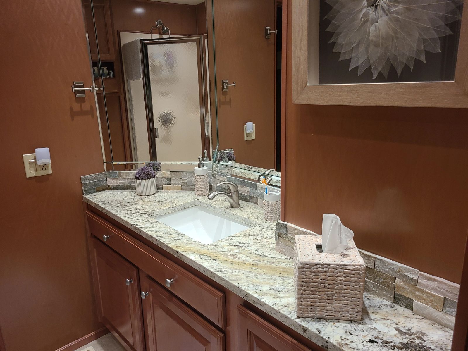 Granite bathroom vanity and wood cabinetry
