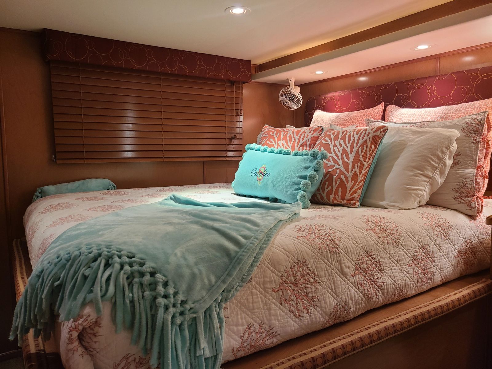 Guest bedroom with television and queen bed