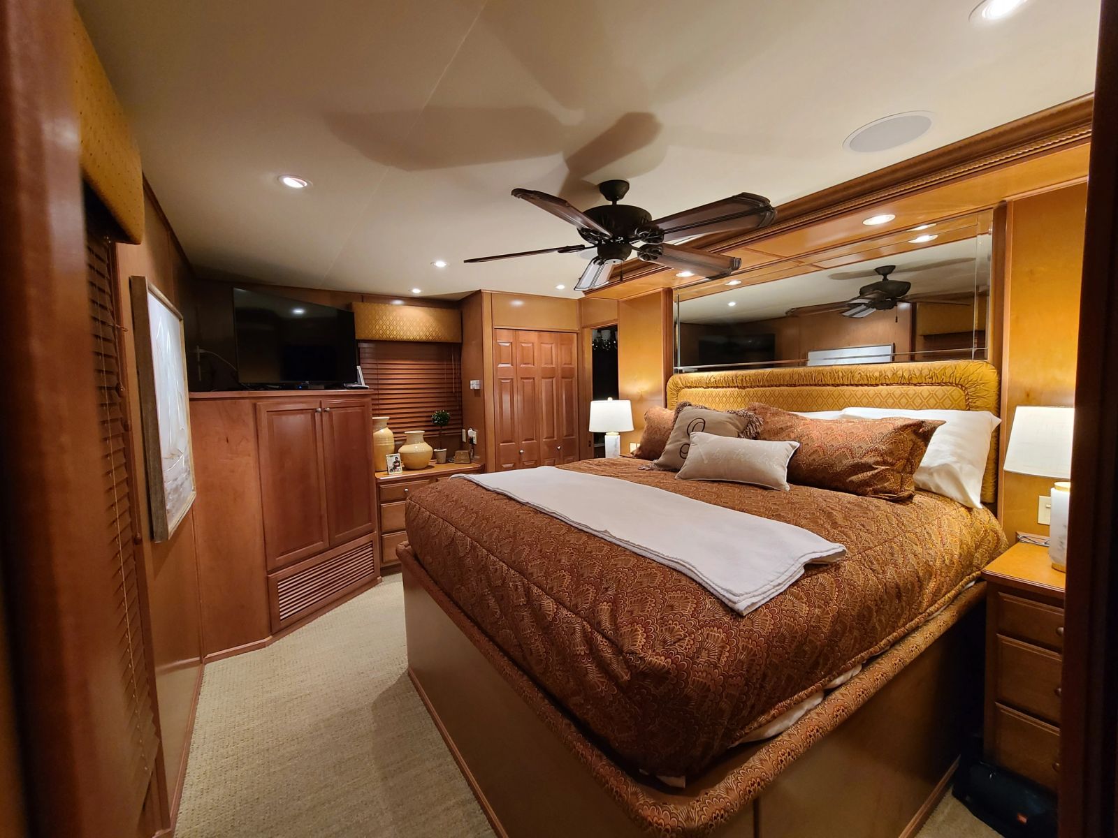 Primary suite with queen bed and built-in cabinetry