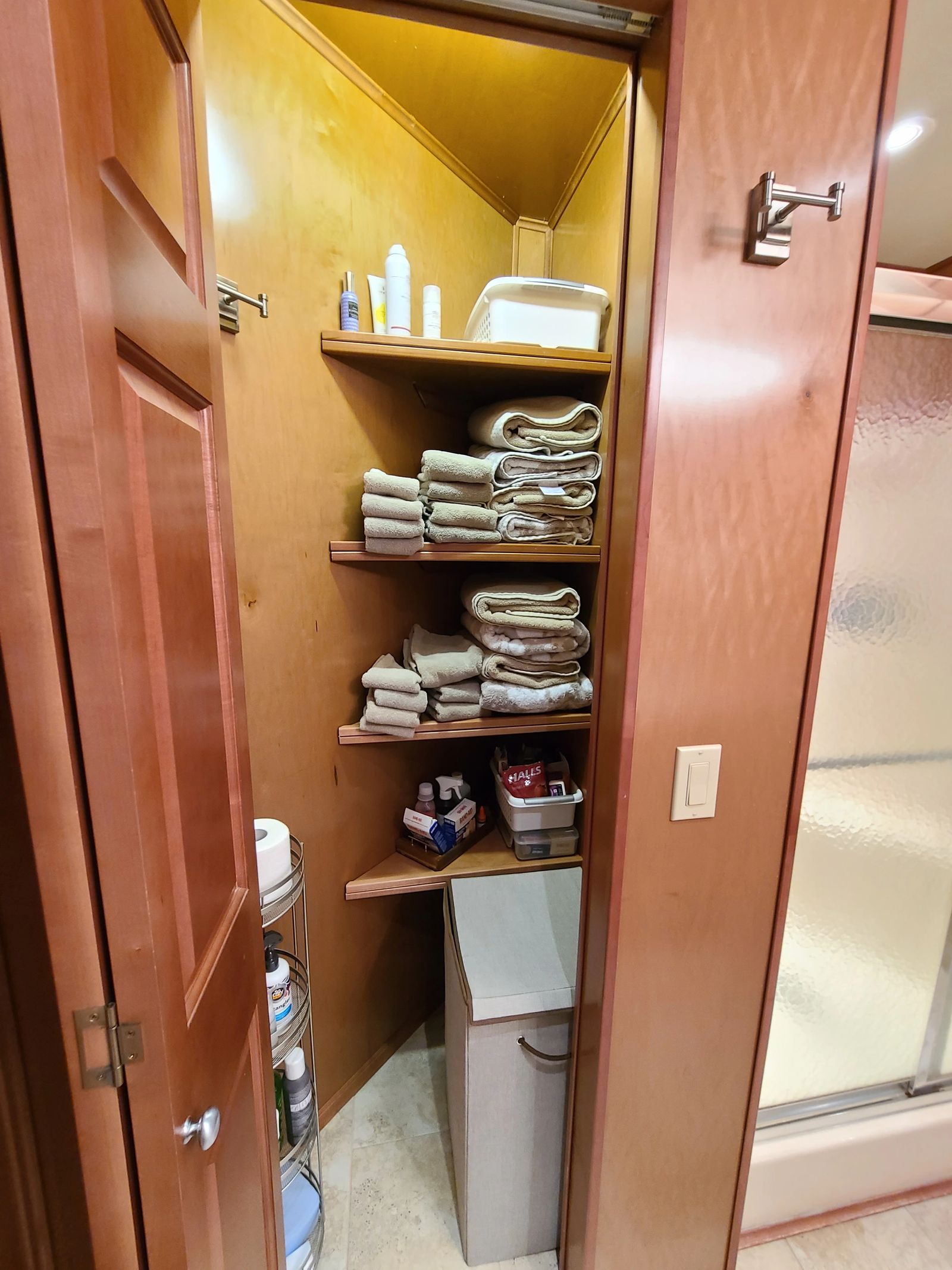 Bathroom linen storage and built-in shelving