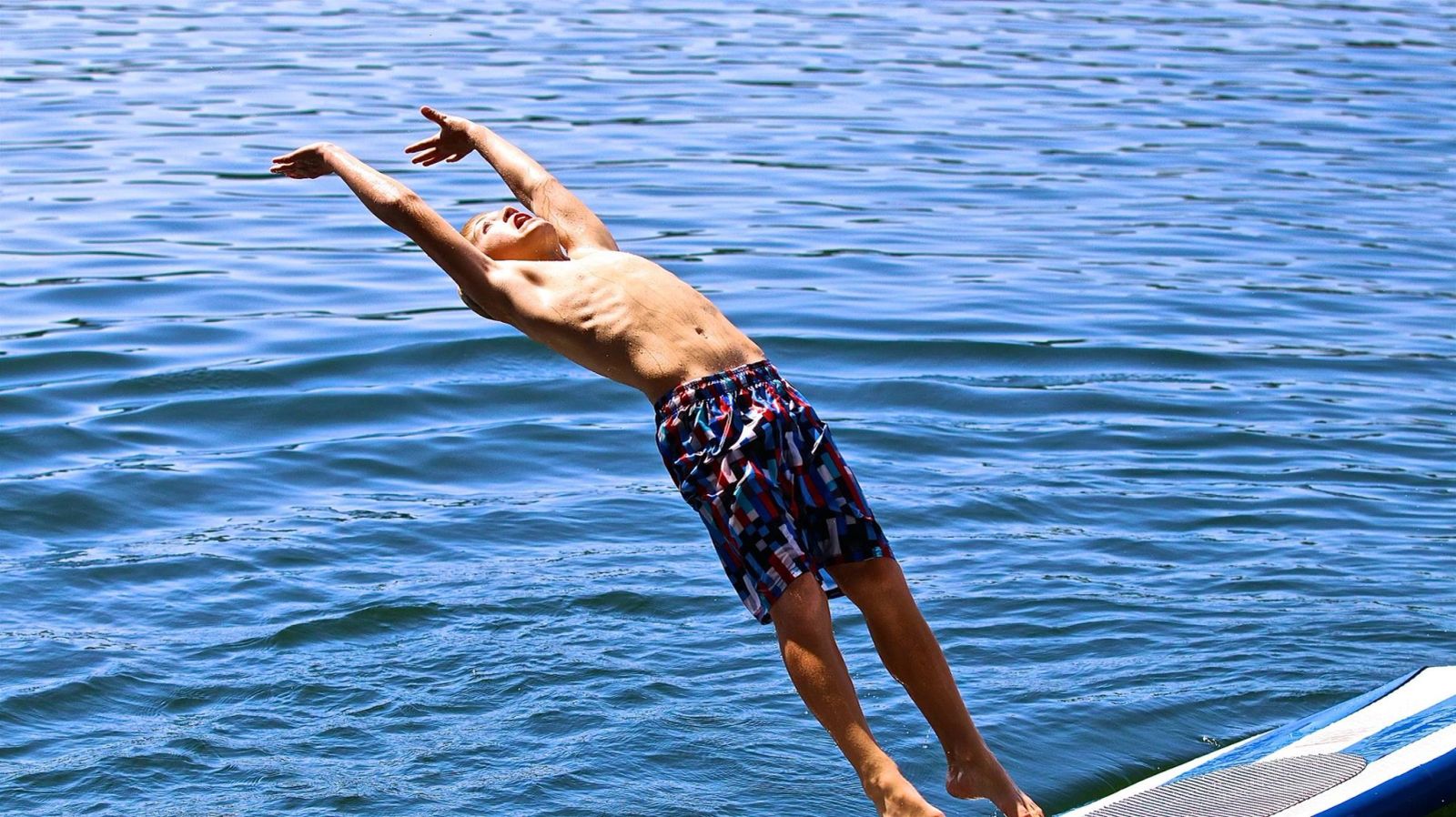 Diving into the clear water of Lake DeGray
