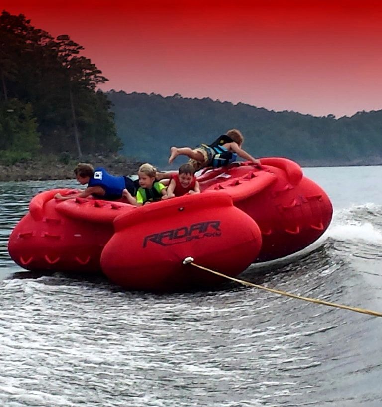 Tubing behind the boat on Lake DeGray